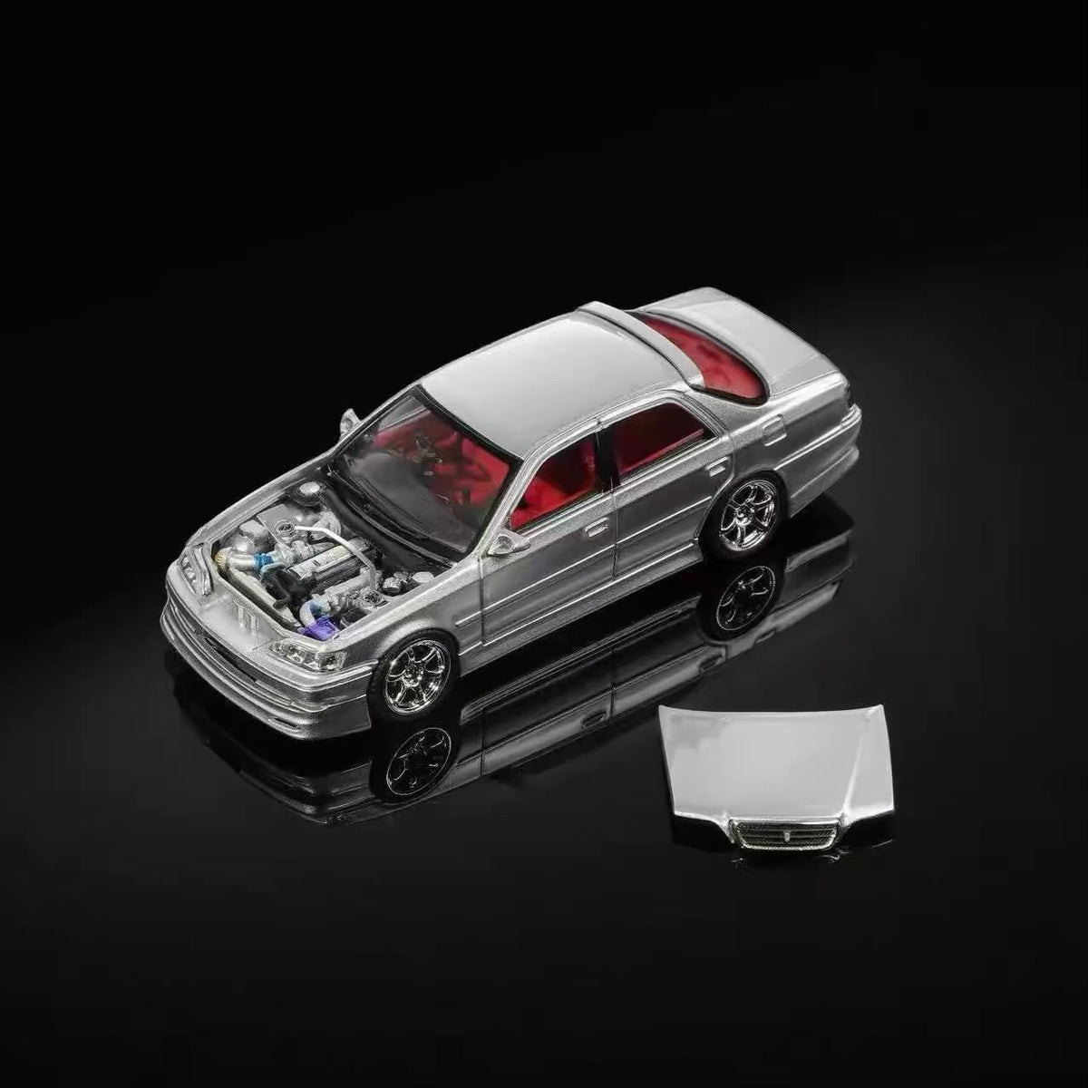 Silver 1/64 Toyota JZX100 Cresta model car with open hood and red interior