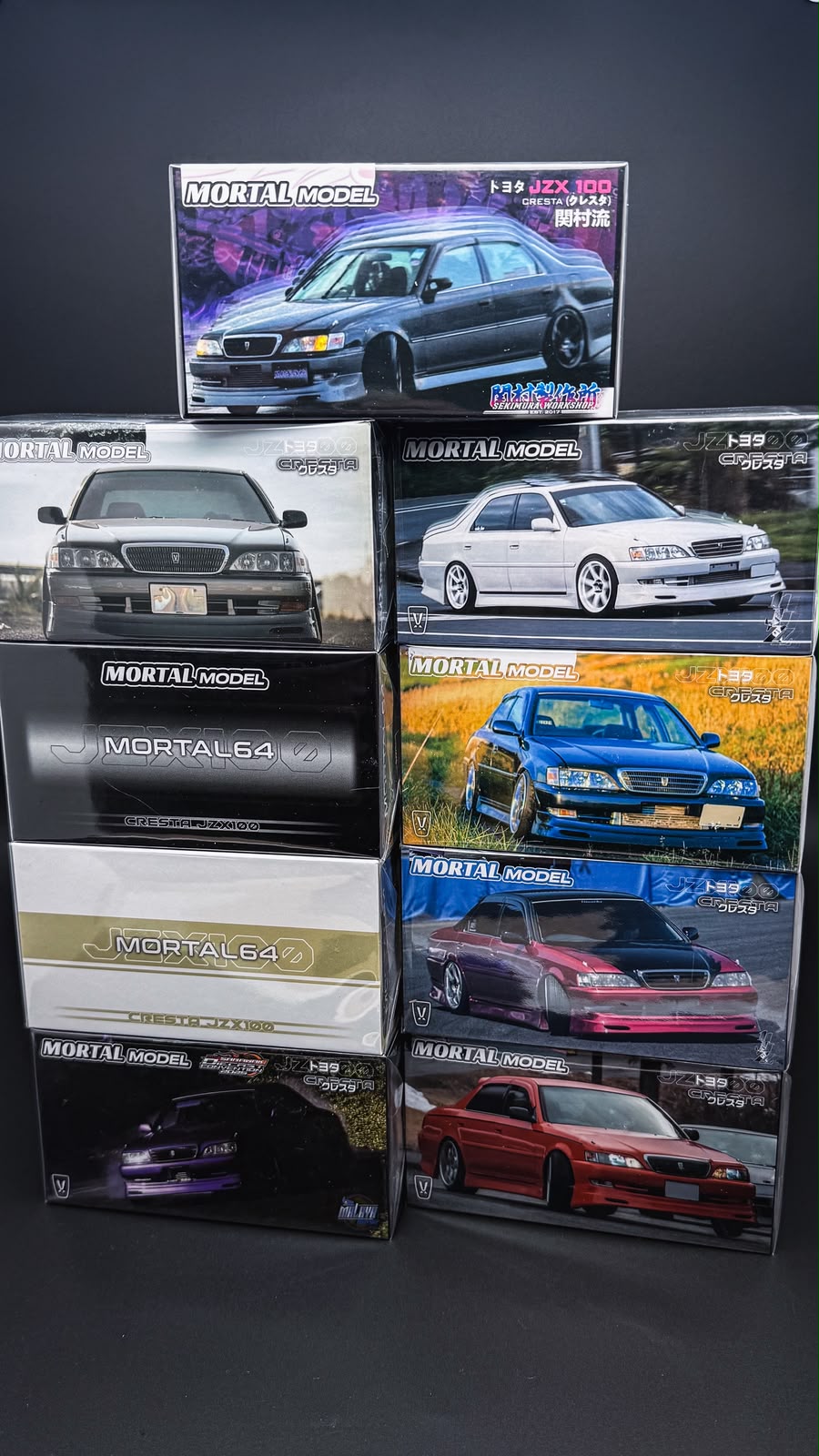Assorted 1/64 Toyota JZX100 Cresta model cars in retail display boxes