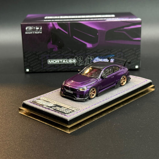 Purple model car with gold wheels on gray stone display base