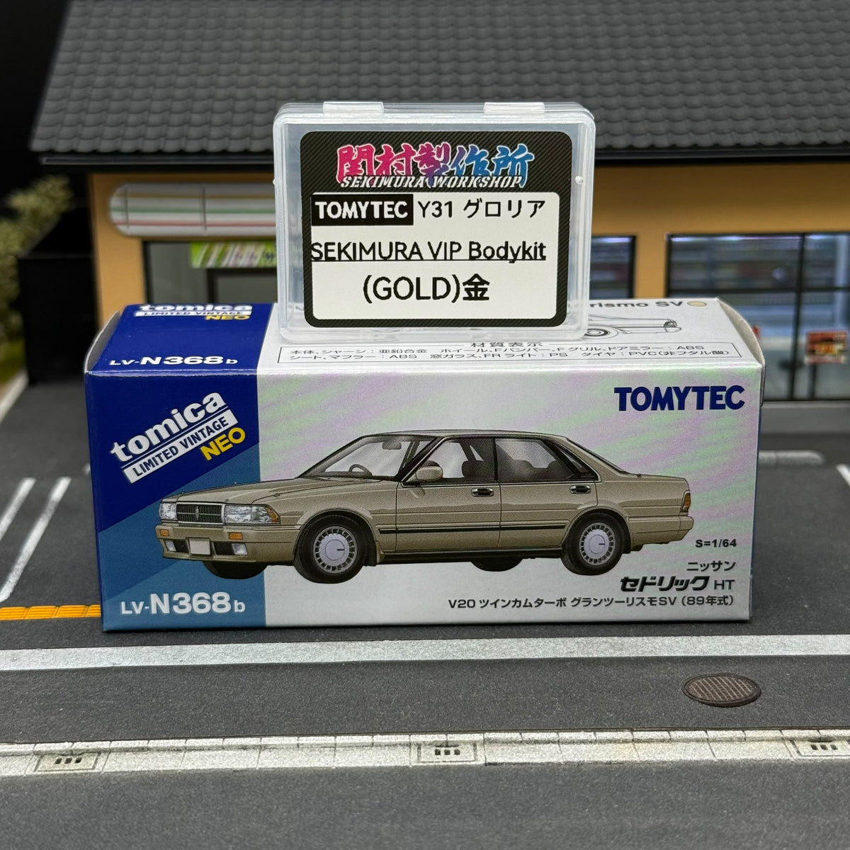 Gold Sekimura VIP bodykit package for Tomytec Nissan Y31 Cedric, shown with model box