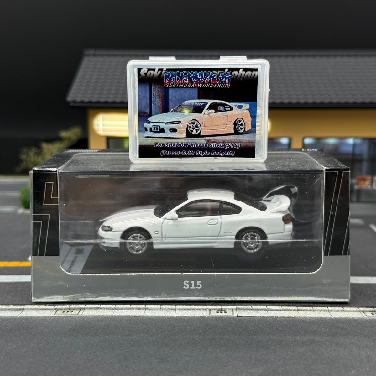 White S15 scale model car with bodykit, rear wing, and display box